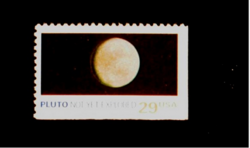 Sello postal de 1991 que decía: "Plutón: Aún no explorado" (Foto: http://pluto.jhuapl.edu/)